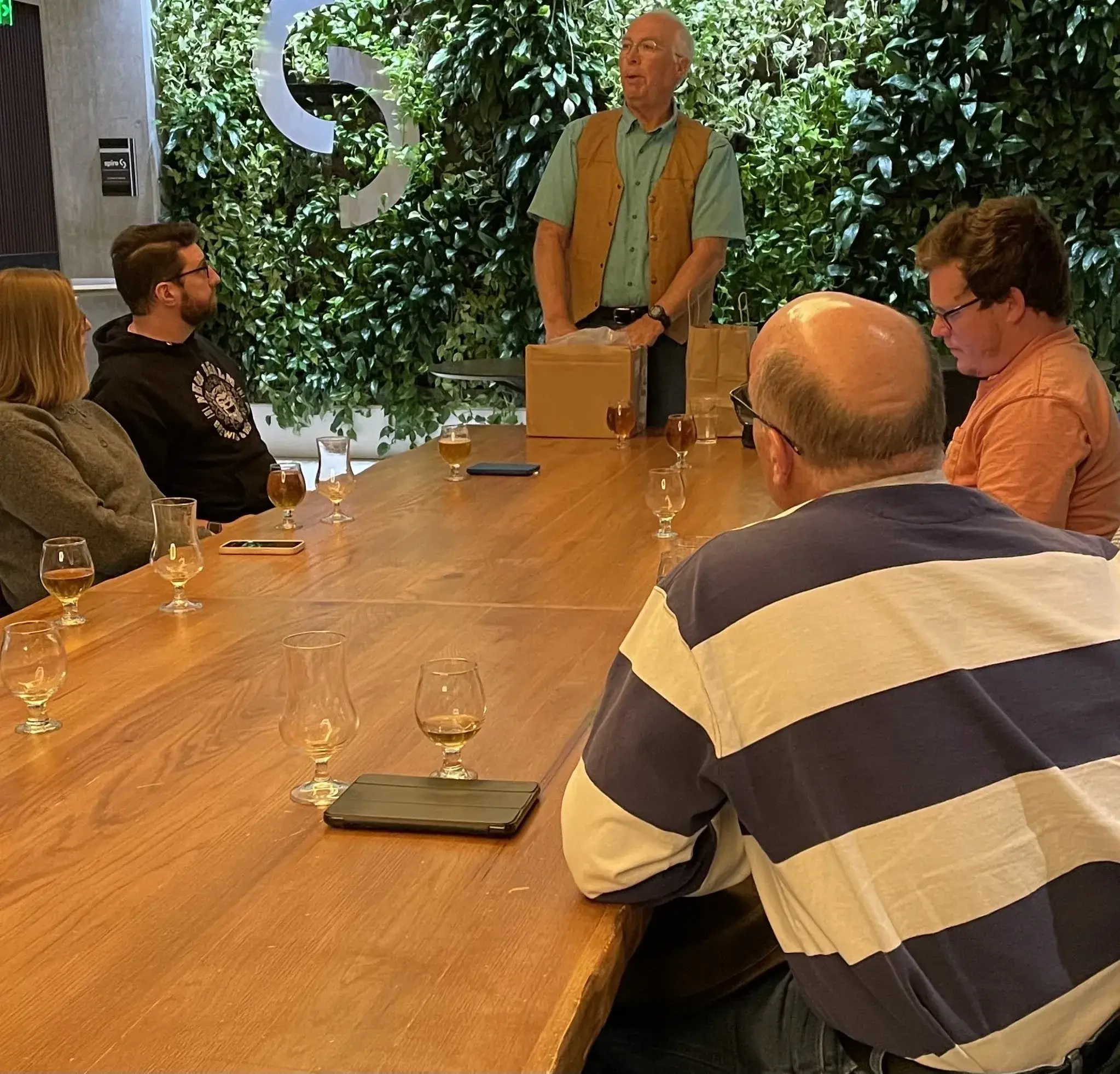 Group tasting session around a wooden table